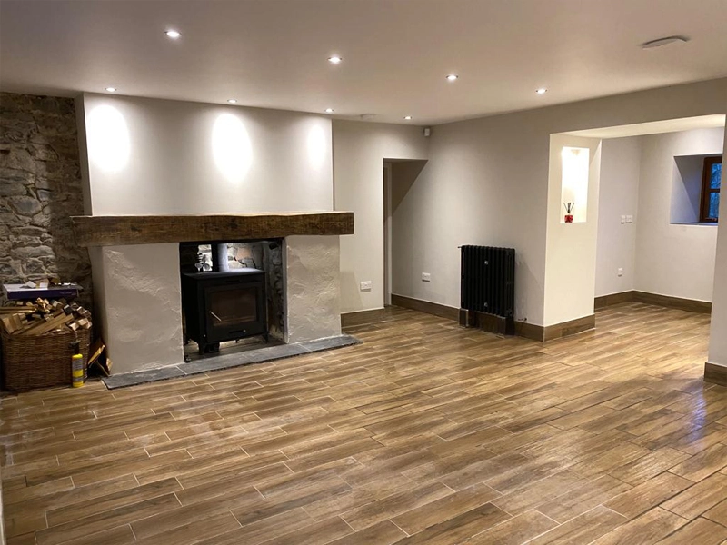Renovated House With Wood Effect Floor Tiles, Back Boiler Stove, Large Wooden Mantel Piece And Cast Iron Radiators With Recessed Downlights