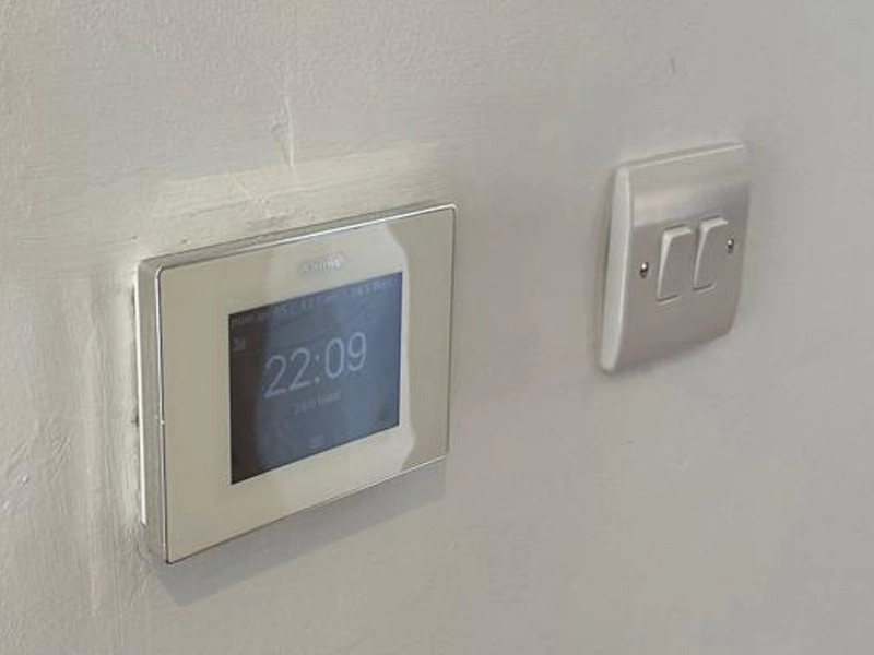 Warmup Electric Underfloor Heating Controller Mounted On A Wall